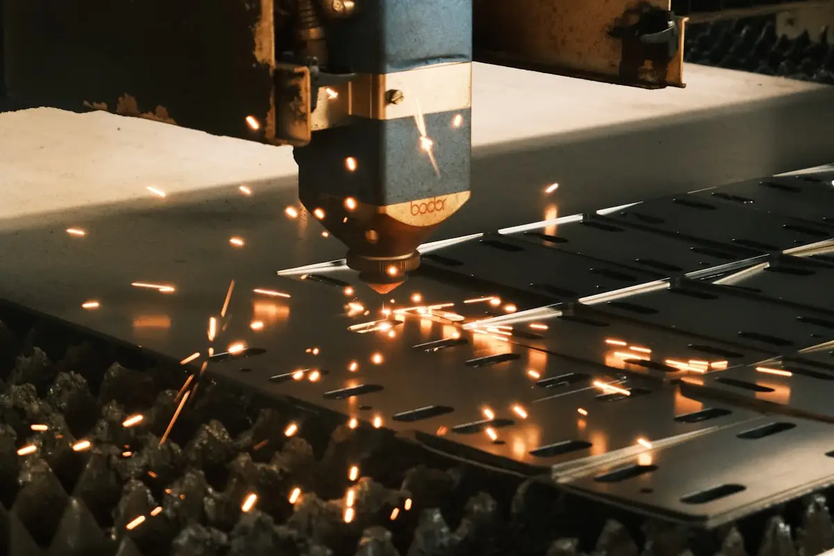 Manufacturing machine cutting metal with sparks flying
