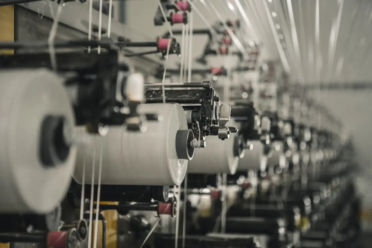 A row of manufacturing machines on a production floor